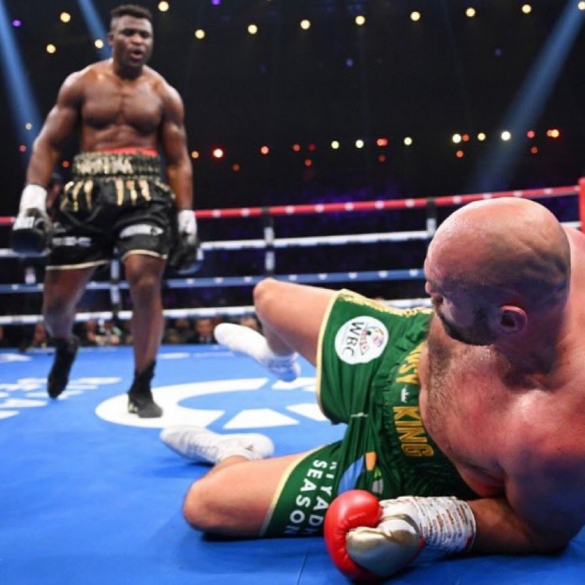 Francis Ngannou (standing) and Tyson Fury (lying on the floor) at the fight between the two sides in Riyadh, Saudi Arabia on October 28, 2023