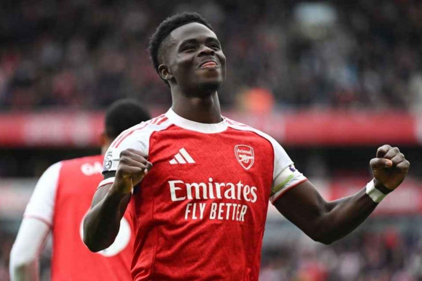 Saka ăn mừng bàn thắng ở lần ra sân thứ 200 cho Arsenal (Ảnh: ESPN).