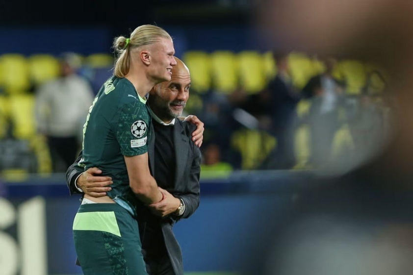 Pep Guardiola hài lòng khi Man City “chia lửa” bàn thắng cho Haaland (Ảnh: The Independent).