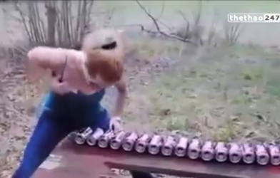 VIDEO: Người đẹp dùng ngực đập vỡ 20 lon bia