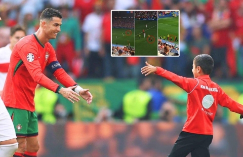 Tuyệt vời hình ảnh Ronaldo phản ứng với fan nhí lao xuống sân