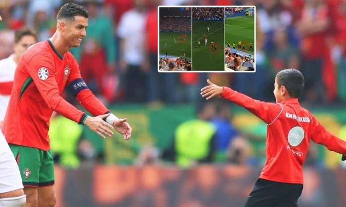 Tuyệt vời hình ảnh Ronaldo phản ứng với fan nhí lao xuống sân