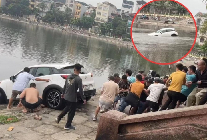 Xe SUV ‘đi lạc’ xuống hồ Định Công, hàng chục người phải hợp sức giải cứu