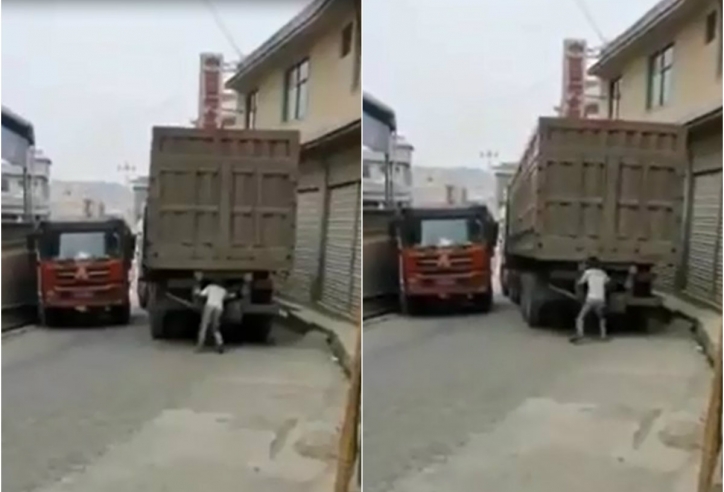 VIDEO: Thanh niên dùng tay bênh đuôi xe container như lực sĩ
