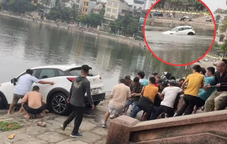Xe SUV ‘đi lạc’ xuống hồ Định Công, hàng chục người phải hợp sức giải cứu