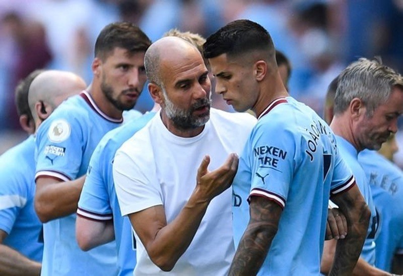 guardiola-cancelo-1687313054.jpeg